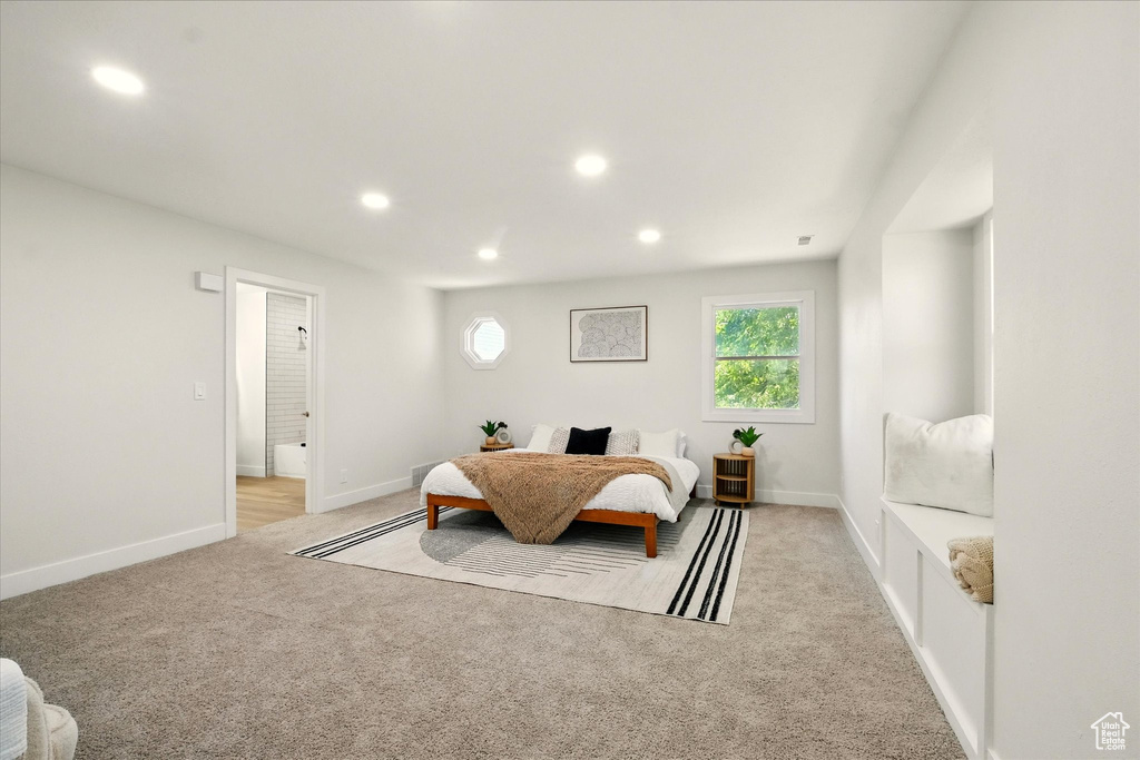 Bedroom featuring light colored carpet and recessed lighting