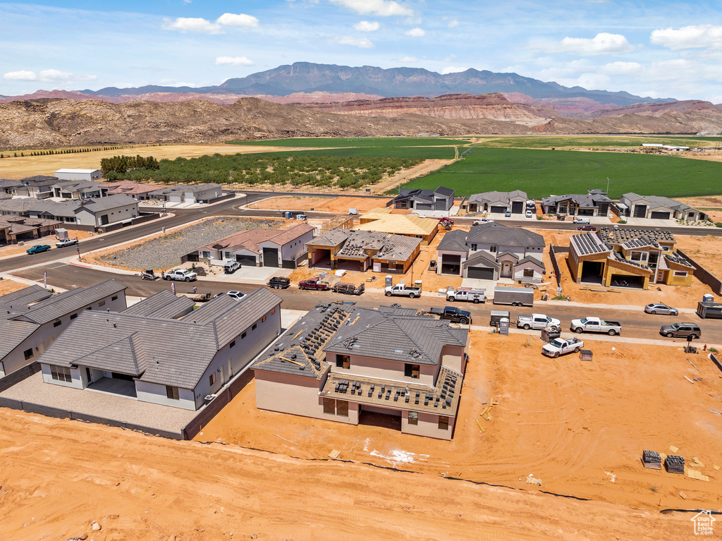 Aerial perspective of suburban area featuring a mountainous background