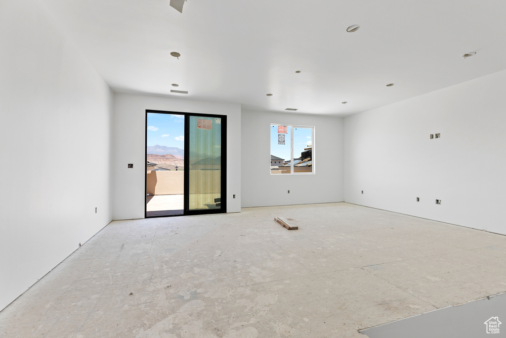 Unfurnished room with healthy amount of natural light