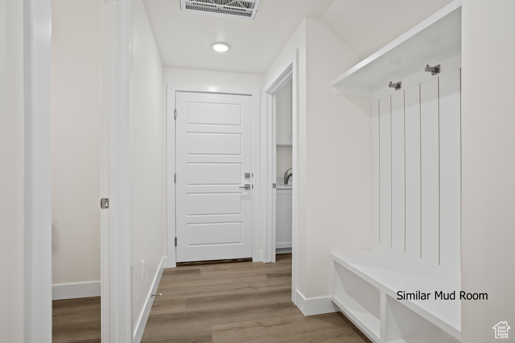 Mudroom featuring wood finished floors and recessed lighting