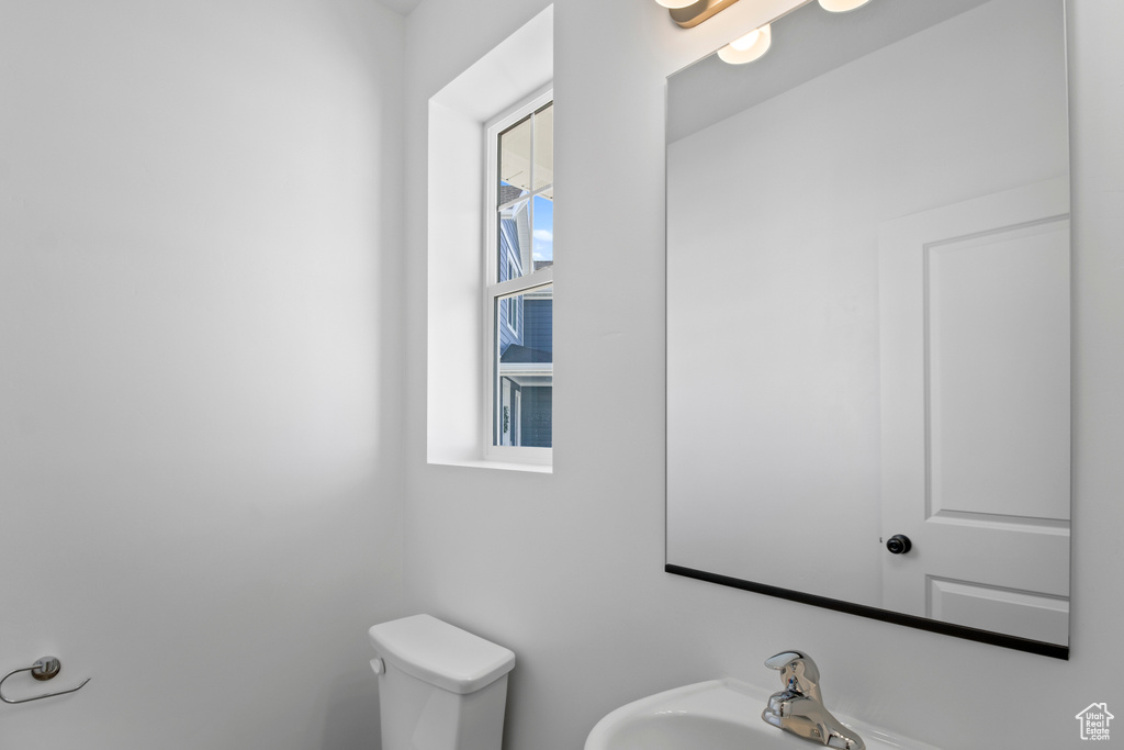 Bathroom featuring a sink and toilet