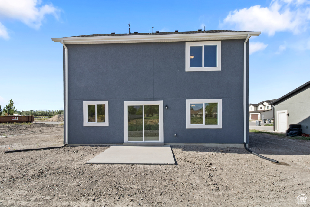Rear view of property featuring a patio
