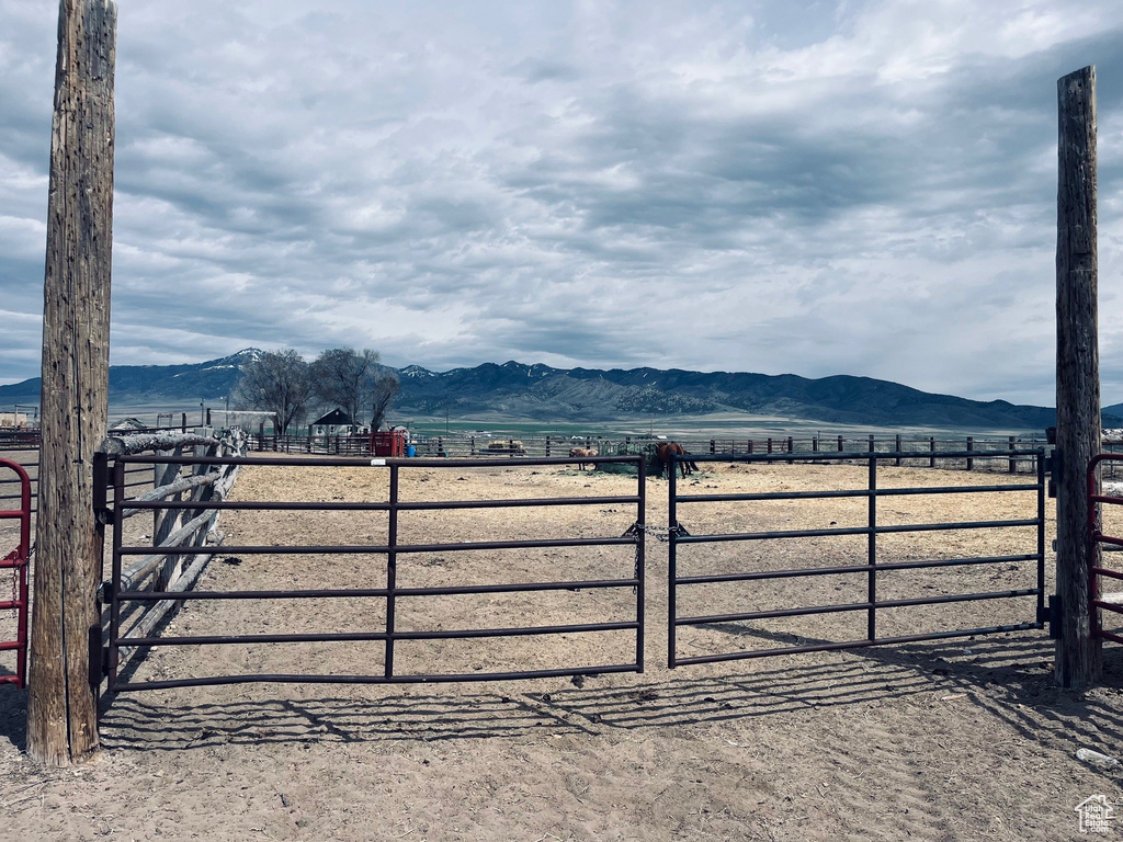 Gate featuring a rural view and a mountain view