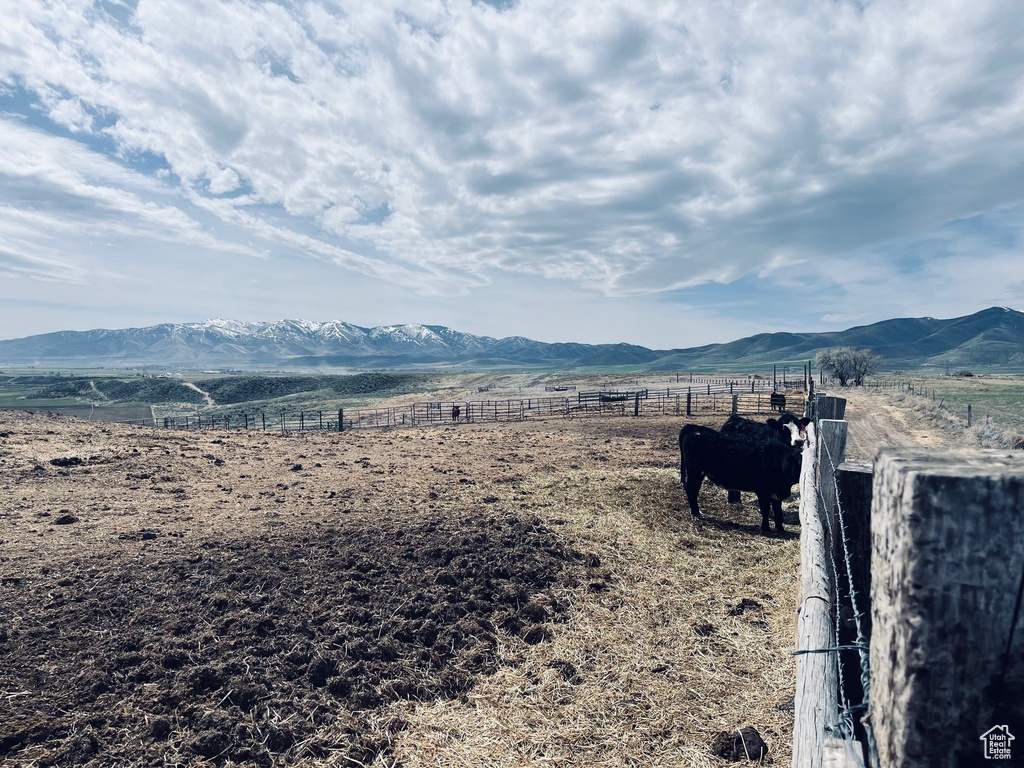 View of mountain background with rural landscape and agricultural land