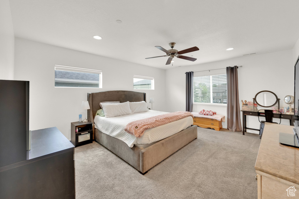 Bedroom featuring light carpet, recessed lighting, and ceiling fan