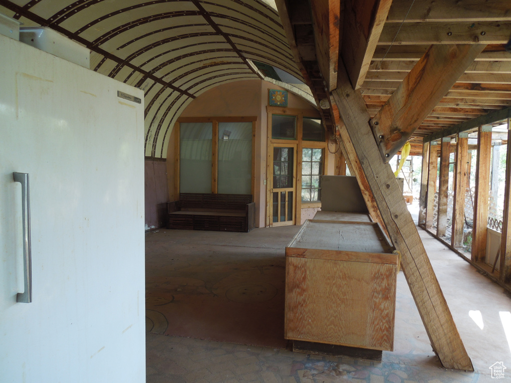 Miscellaneous room with healthy amount of natural light and vaulted ceiling