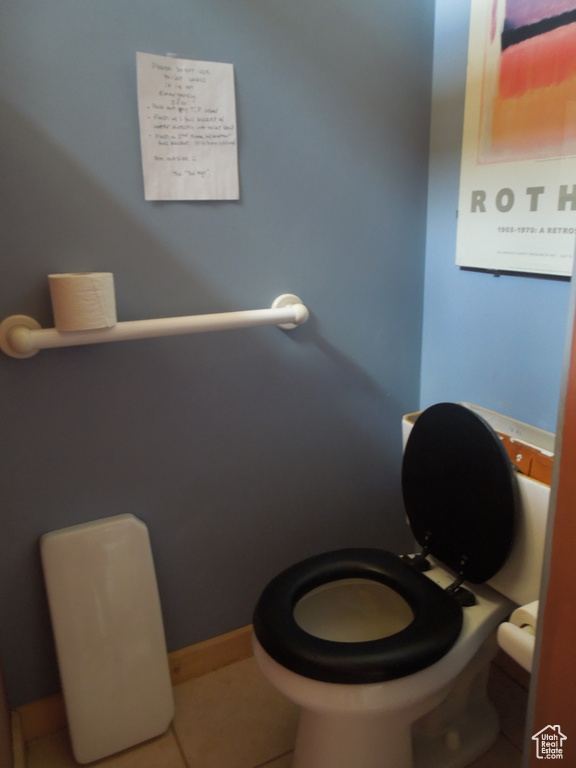Bathroom featuring toilet and tile patterned floors