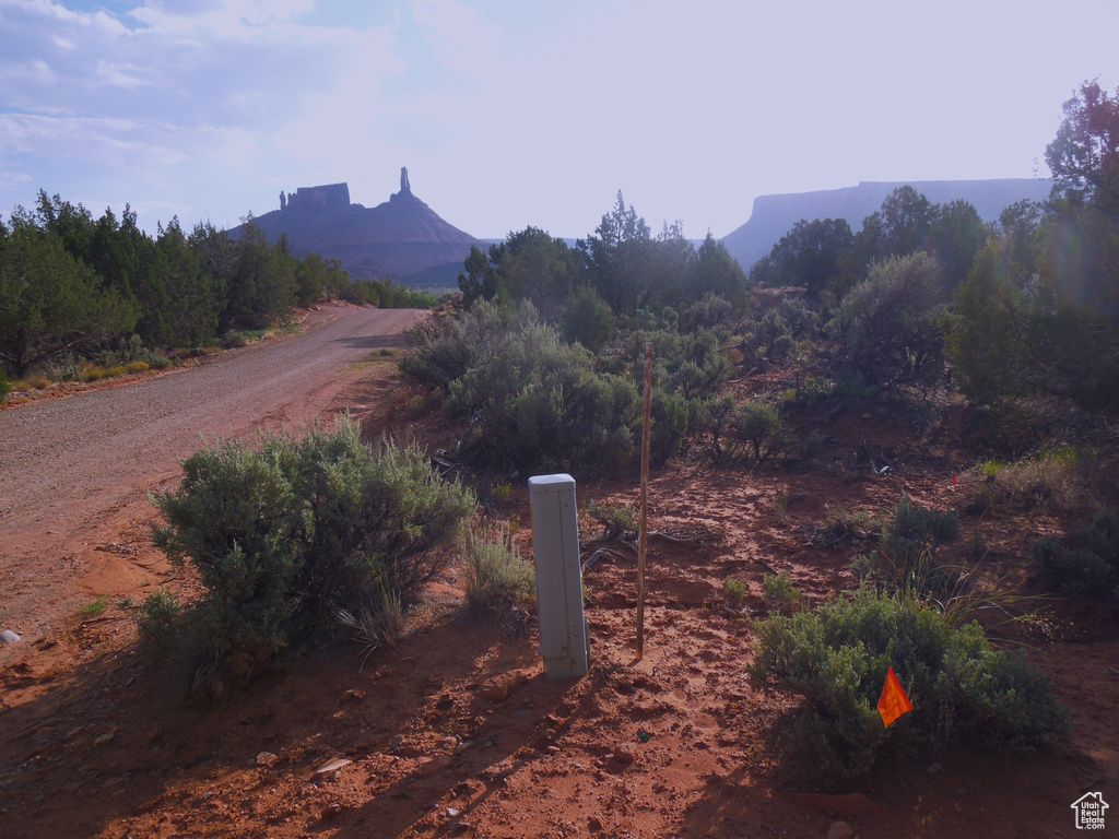 View of dirt / gravel road featuring a mountain view