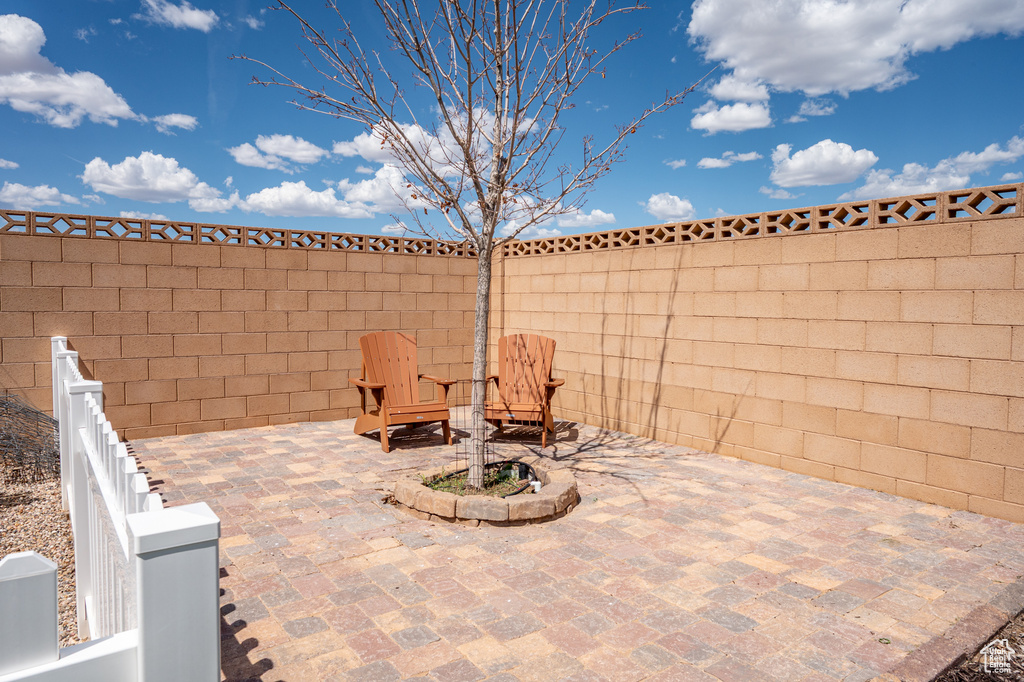 Fenced backyard featuring a patio area