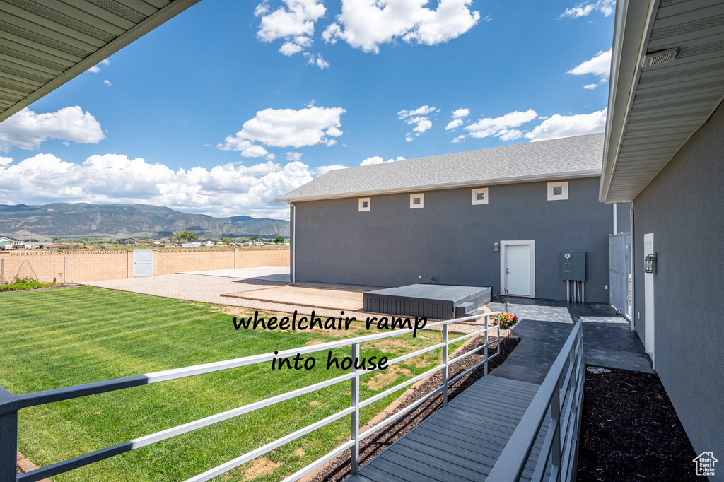 Exterior space with a mountain view and stucco siding