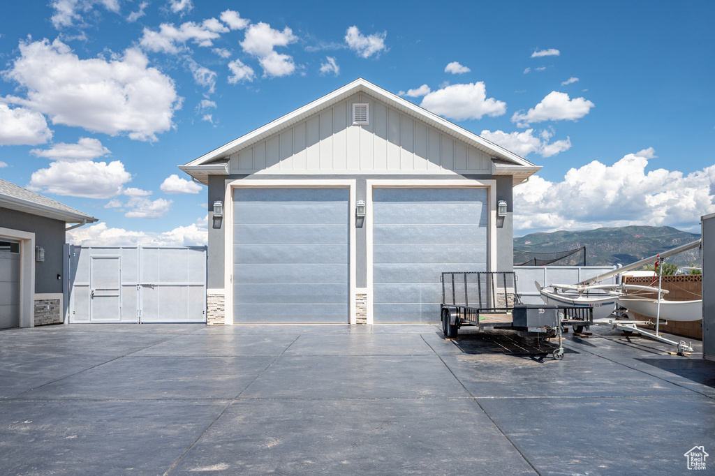 Detached garage featuring a mountain view