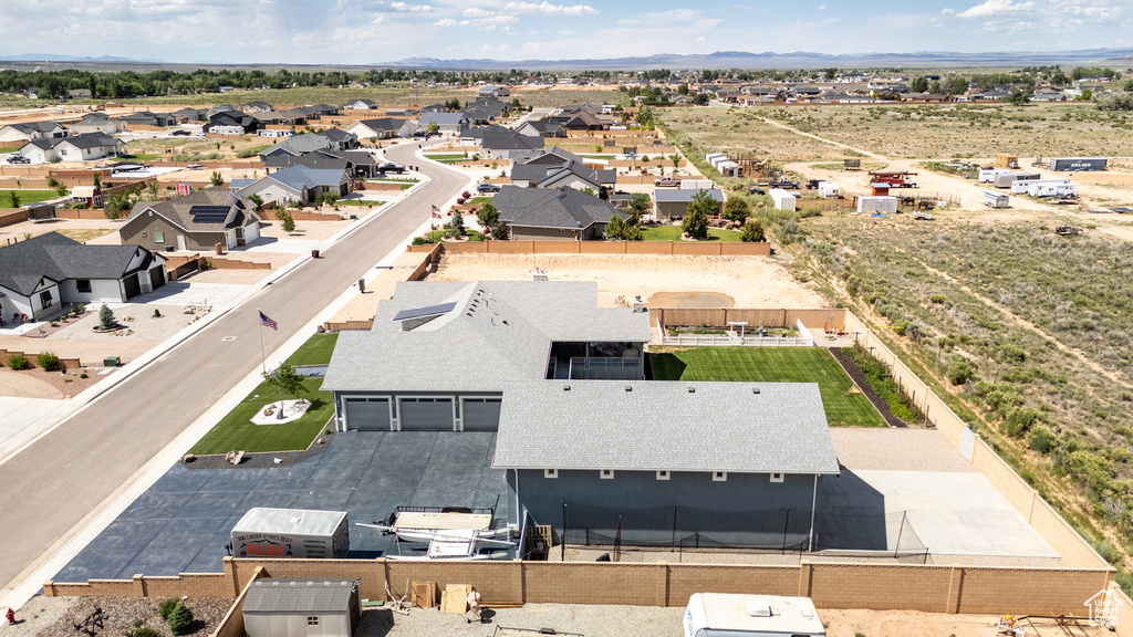 Aerial perspective of suburban area featuring a mountainous background
