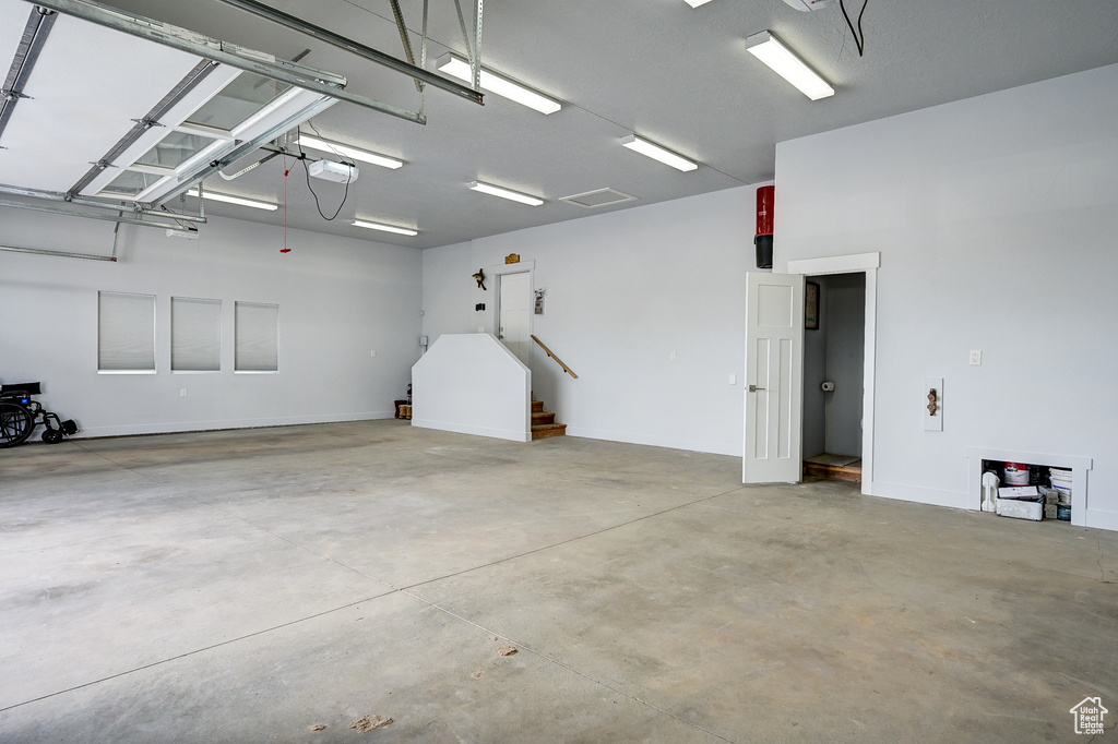 Garage featuring a garage door opener