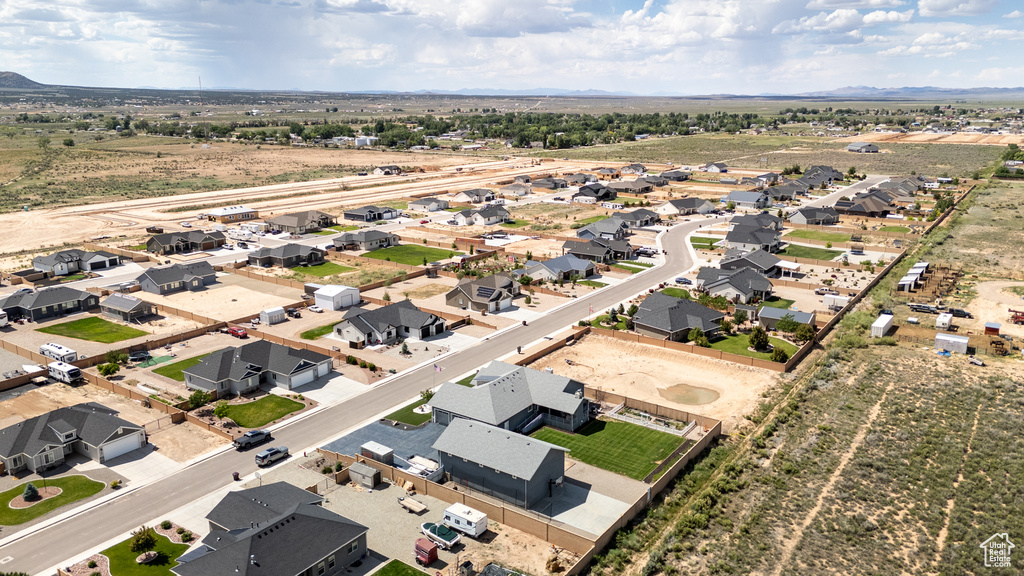 View of property location featuring nearby suburban area and a mountainous background