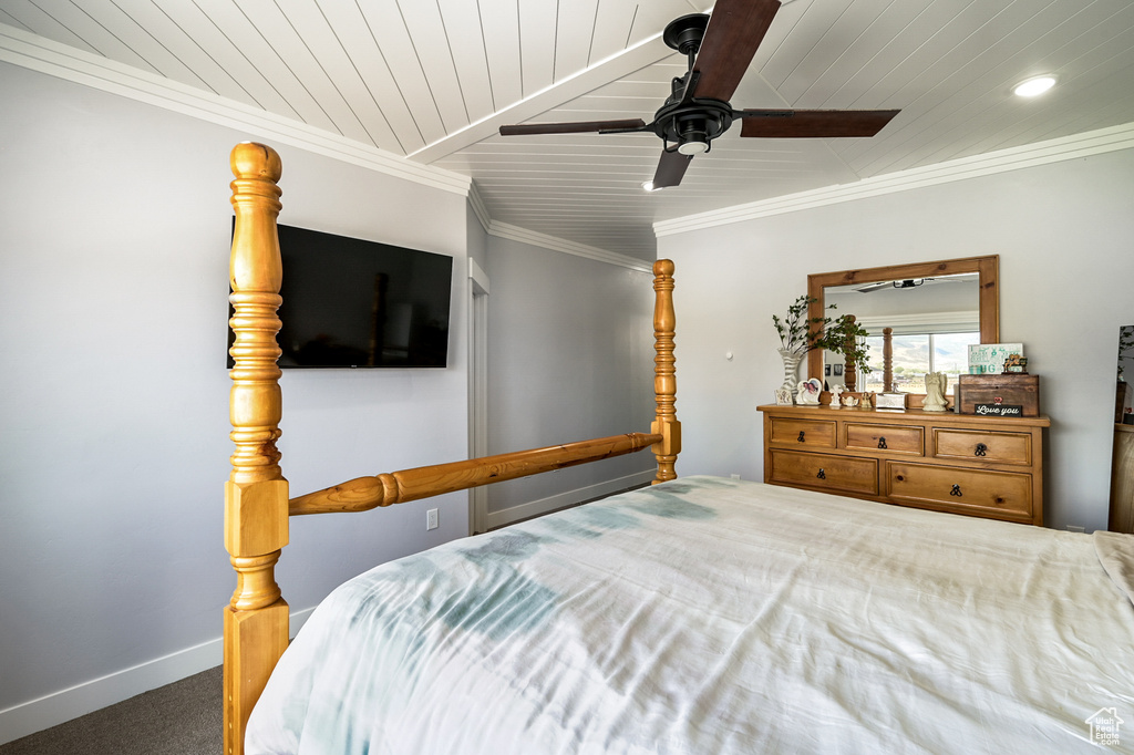 Carpeted bedroom featuring wood ceiling, a ceiling fan, recessed lighting, and crown molding