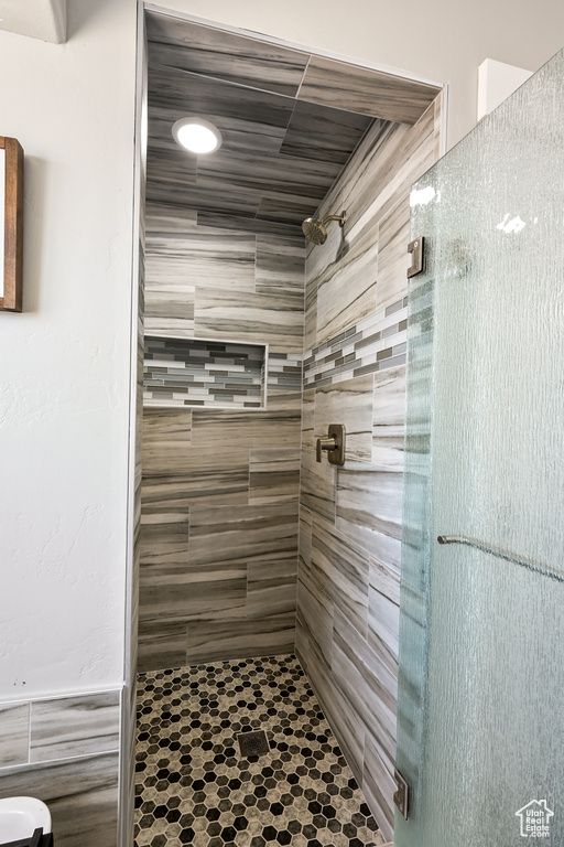 Full bathroom with a shower stall