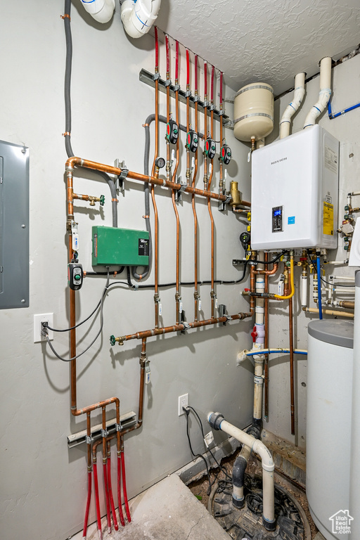 Utilities featuring tankless water heater and electric panel