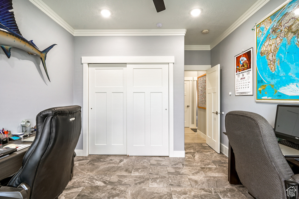 Office area featuring ornamental molding and baseboards