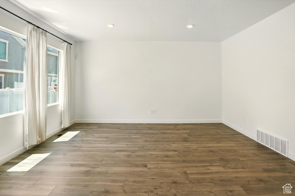 Spare room featuring wood finished floors and recessed lighting