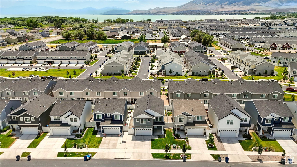 Aerial perspective of suburban area with a mountainous background