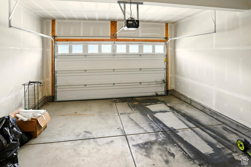 Garage featuring a garage door opener