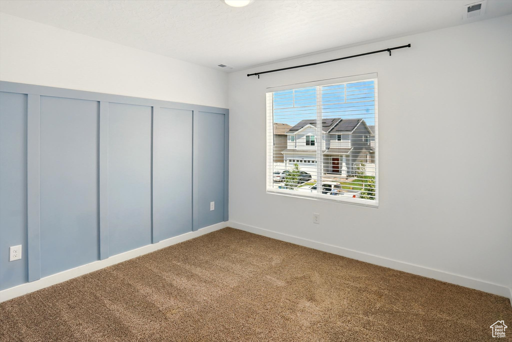Unfurnished bedroom featuring carpet floors and a closet