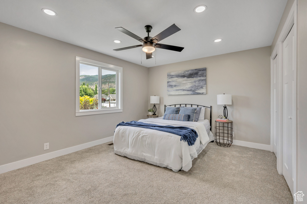 Carpeted bedroom with recessed lighting, a closet, and ceiling fan