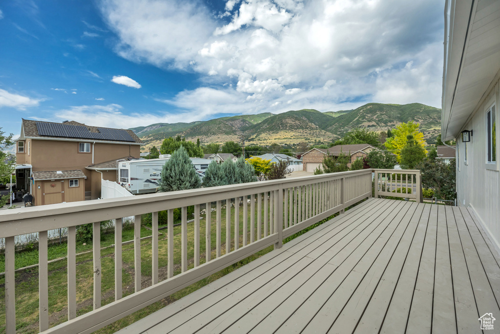 Deck featuring a mountain view and a shed