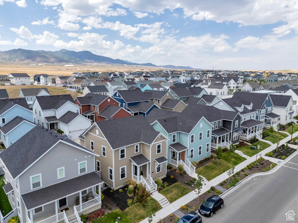Aerial perspective of suburban area featuring a mountain backdrop