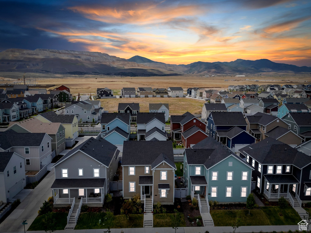 Aerial perspective of suburban area featuring a mountainous background