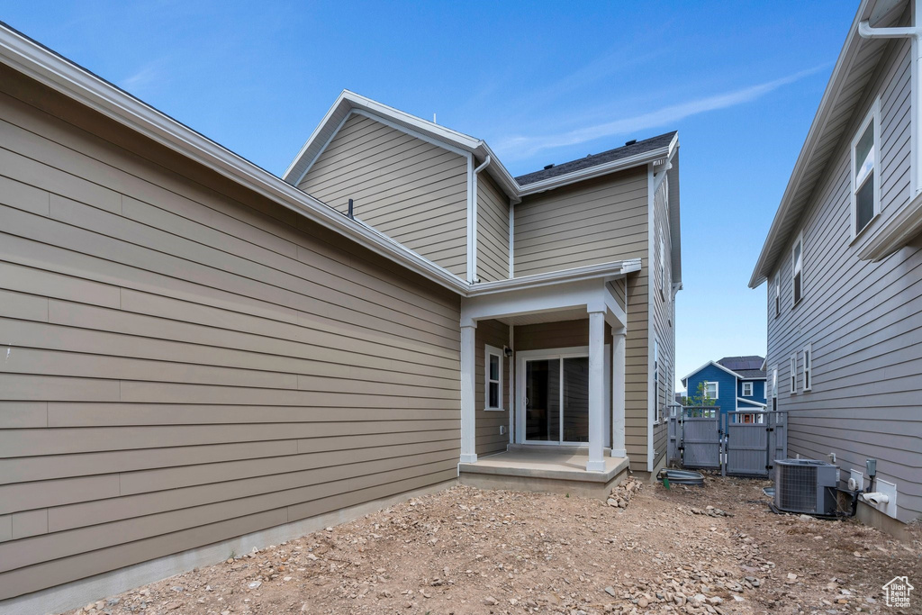 Rear view of property with a gate