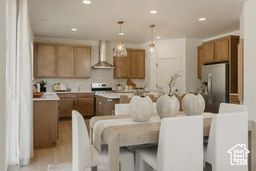Dining room with recessed lighting and light wood-style floors