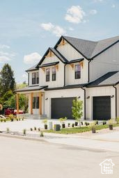View of front of house featuring a garage and driveway