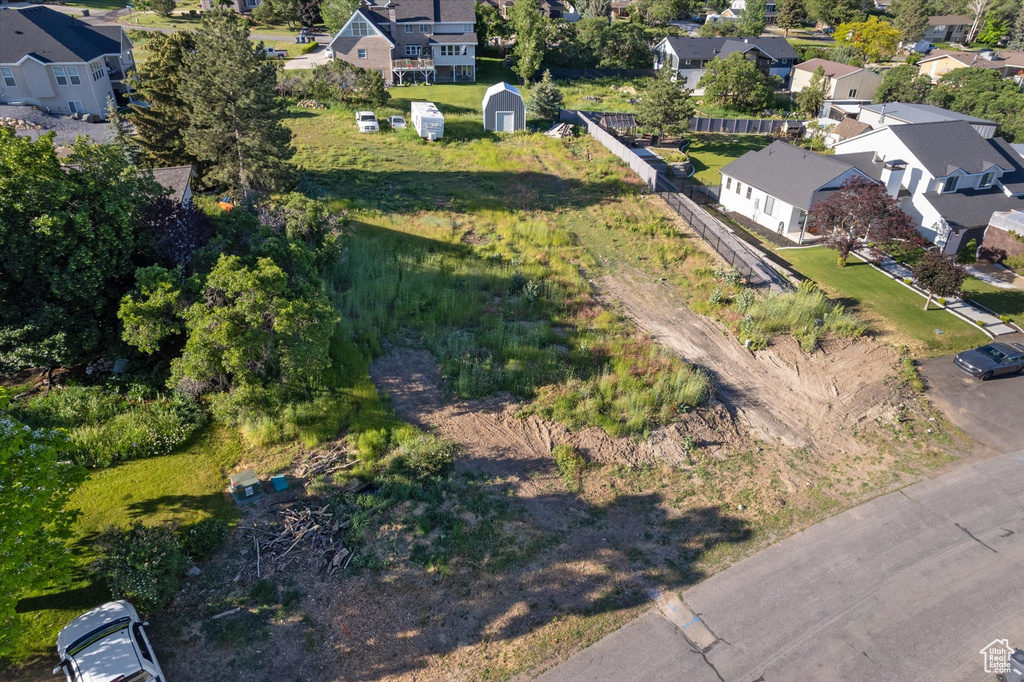 Aerial overview of property's location with nearby suburban area
