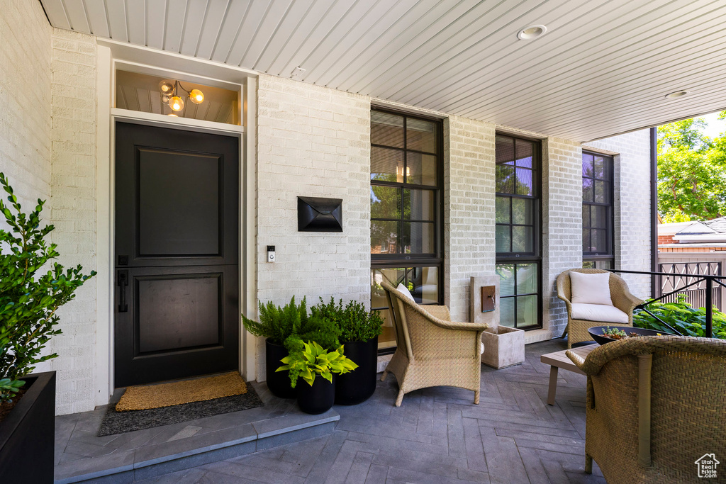 Doorway to property with covered porch