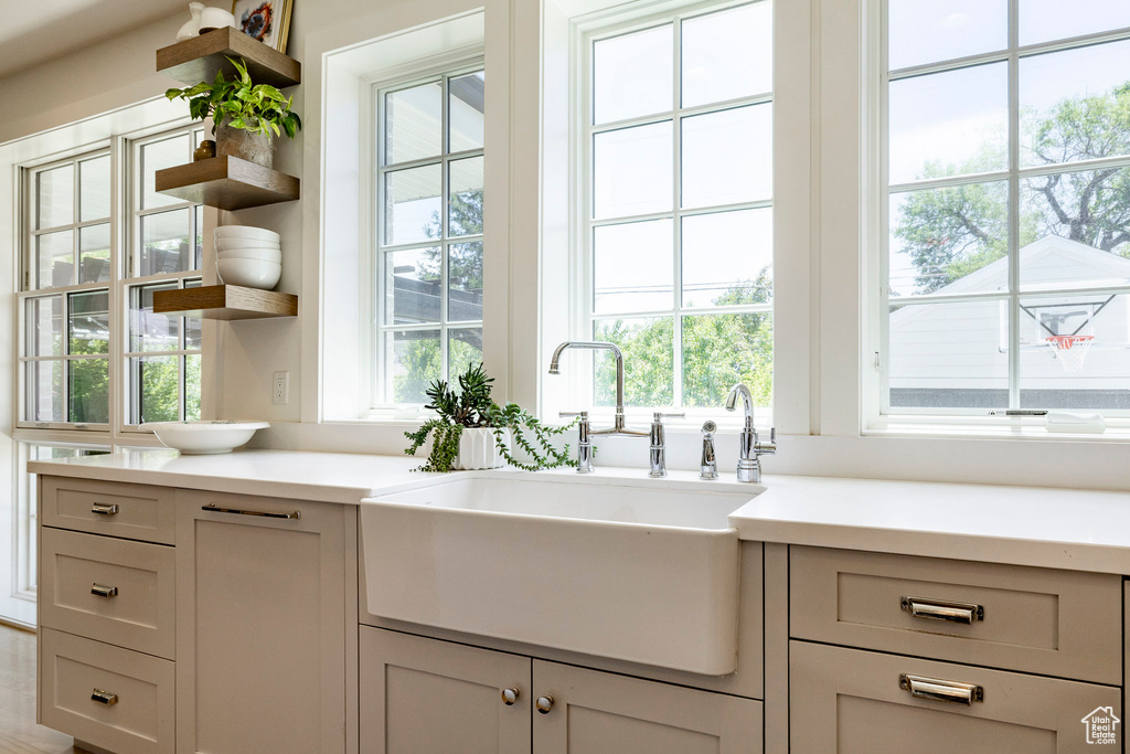 Kitchen featuring open shelves and light countertops
