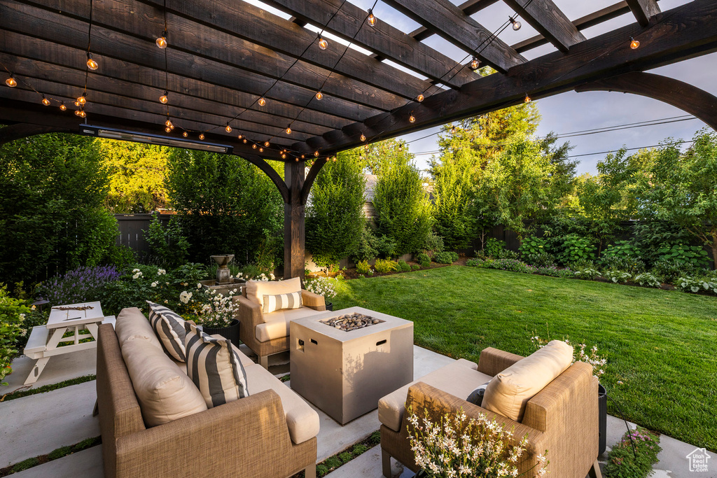 View of patio with an outdoor living space with a fire pit and a pergola