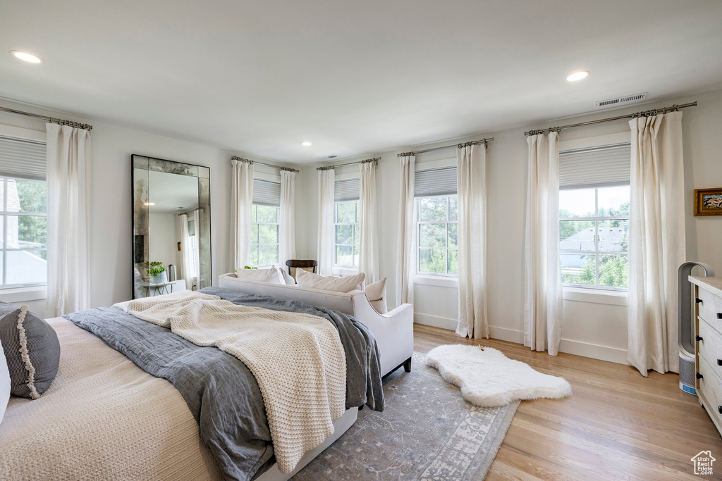 Bedroom with light wood-style flooring and recessed lighting
