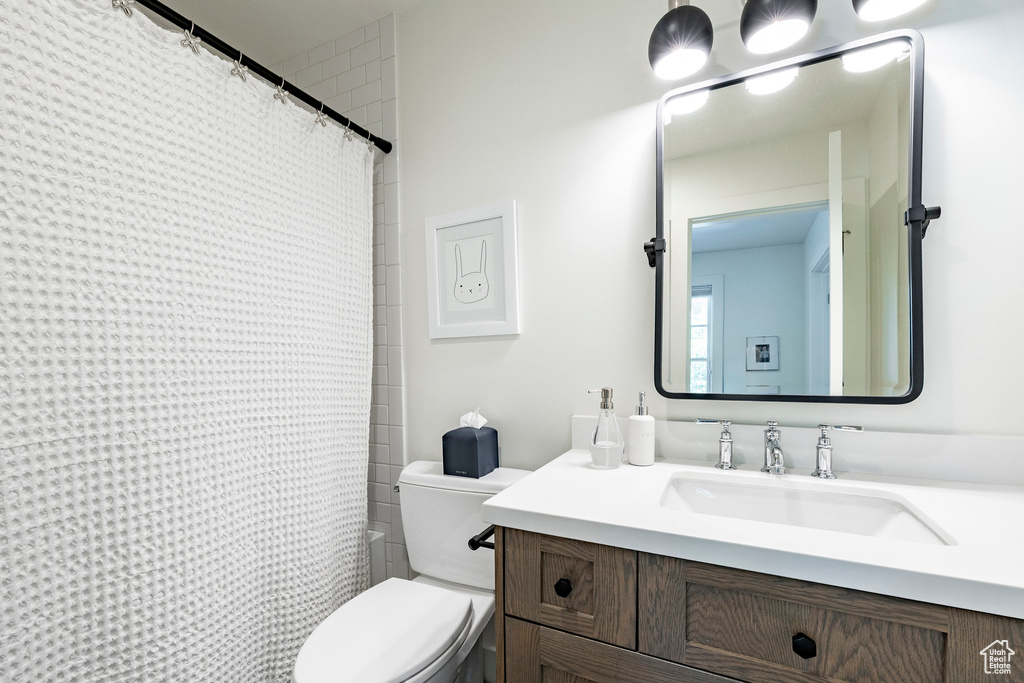 Bathroom featuring vanity and shower / tub combo