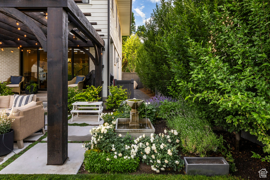 View of yard with a patio area, an outdoor living space, and a pergola