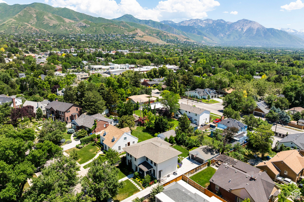 Aerial perspective of suburban area with a mountain backdrop