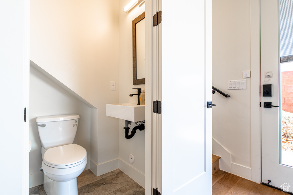 Bathroom with baseboards and toilet