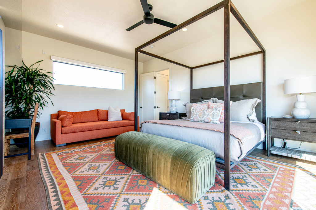 Bedroom with wood finished floors, recessed lighting, and a ceiling fan