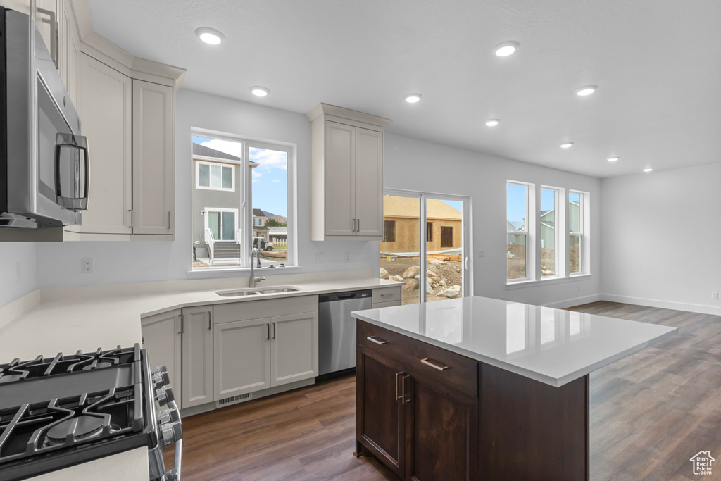Kitchen featuring appliances with stainless steel finishes, healthy amount of natural light, light countertops, and recessed lighting