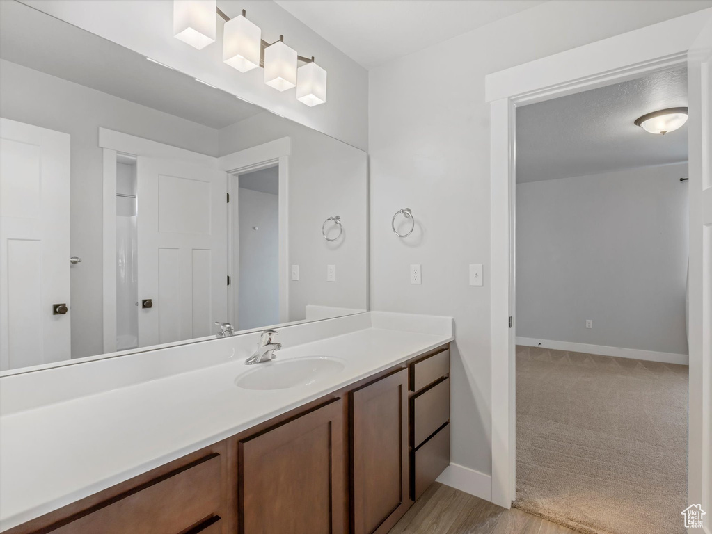 Bathroom featuring vanity and baseboards