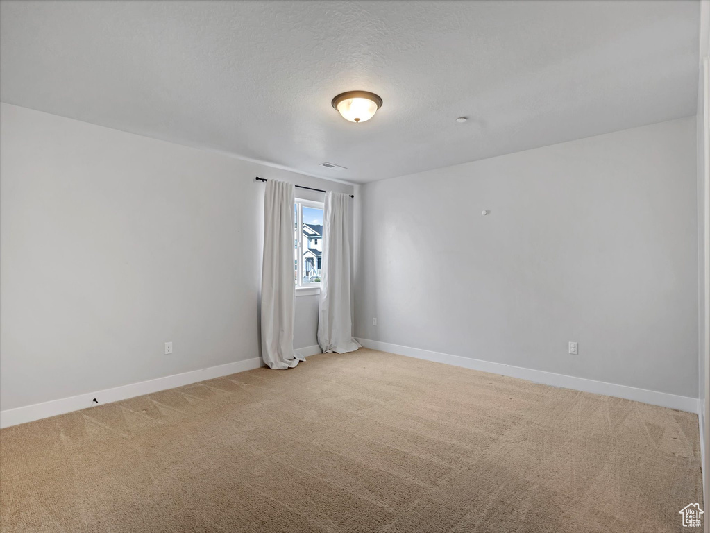 Spare room with light carpet