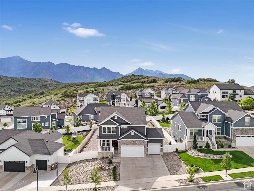 Aerial perspective of suburban area with a mountainous background