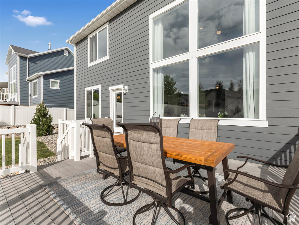 Wooden deck featuring outdoor dining area