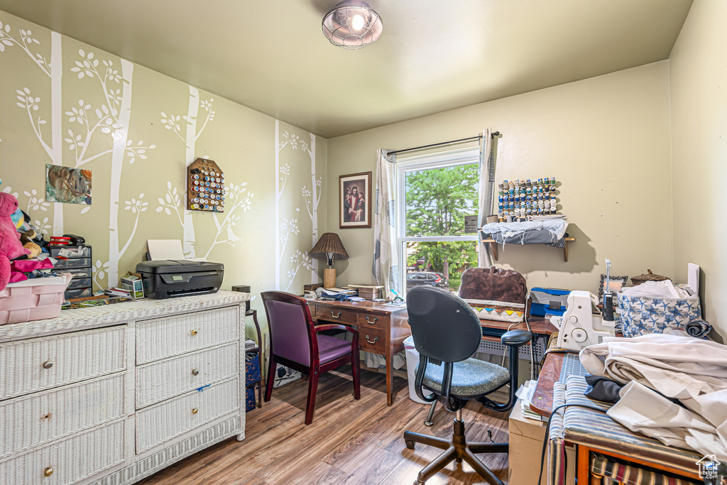Office with wood finished floors