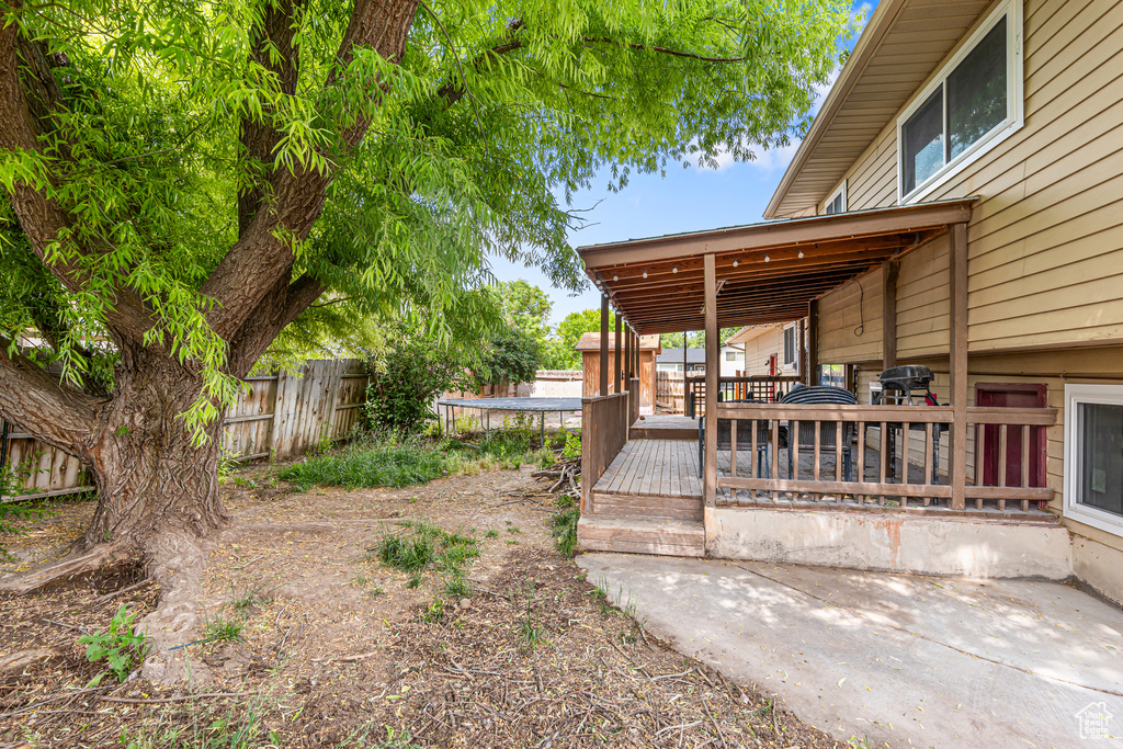 View of yard with a wooden deck